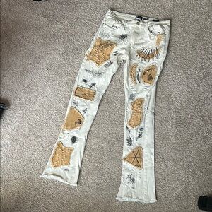 White and Tan Bootcut Jeans with Distressed Details